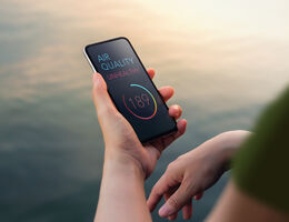 A phone display warns "Air quality unhealthy: 189."